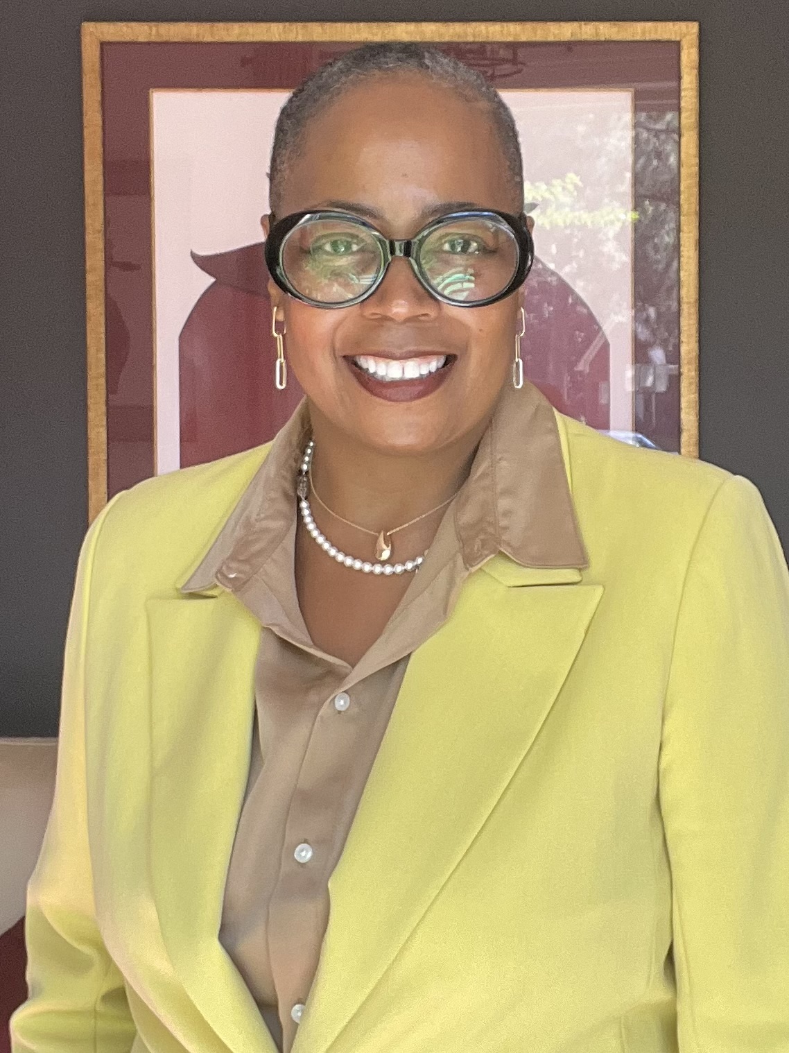 Mary Geter founder of Beyond the Hairline smiling warmly in a professional setting.